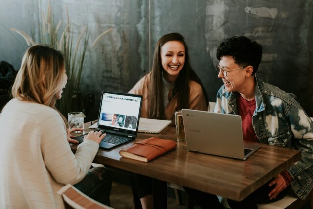 office colleagues at laptops