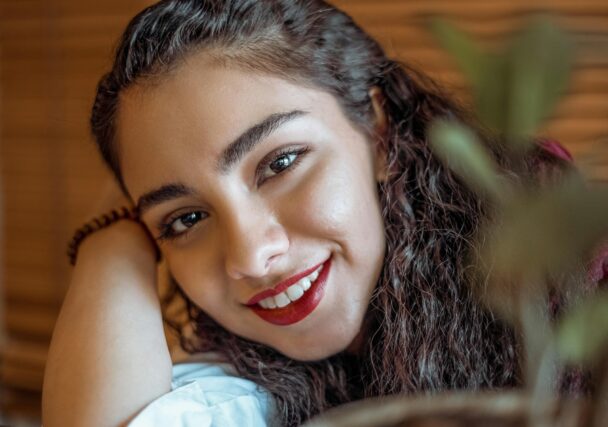 smiling woman with red lipstick