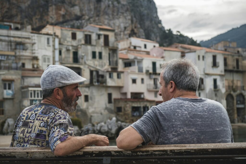 two men sightseeing by ruins