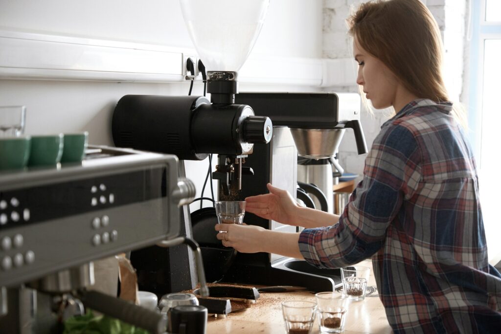 woman using coffee machine