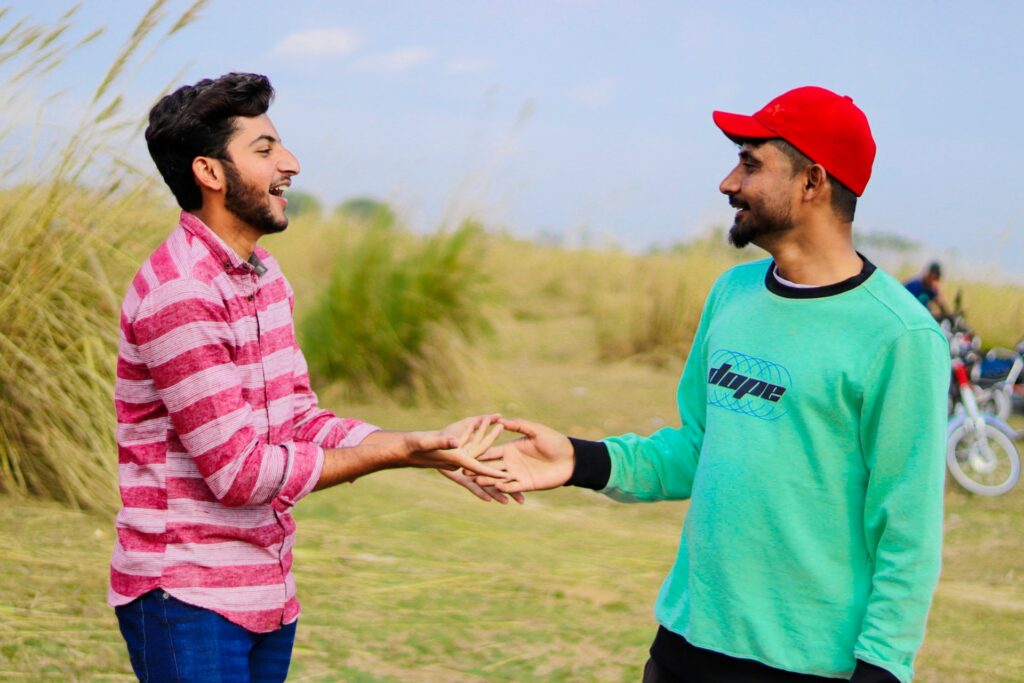 two male friends chatting on hike